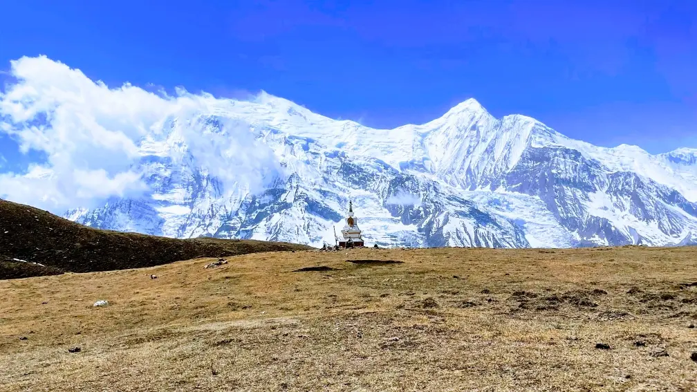 A Shrine by the Ice Lake, situated at 4500m in Manang, Nepal, backdropped by the Annapurna range